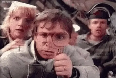 Rick Moranis with a magnifying glass in Honey I Shrunk the Kids